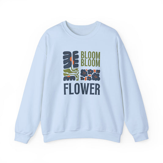 "FIBRIO Bloom Flower Sweatshirt front in sky blue – casual graphic pullover with bright floral artwork, soft cotton blend material."